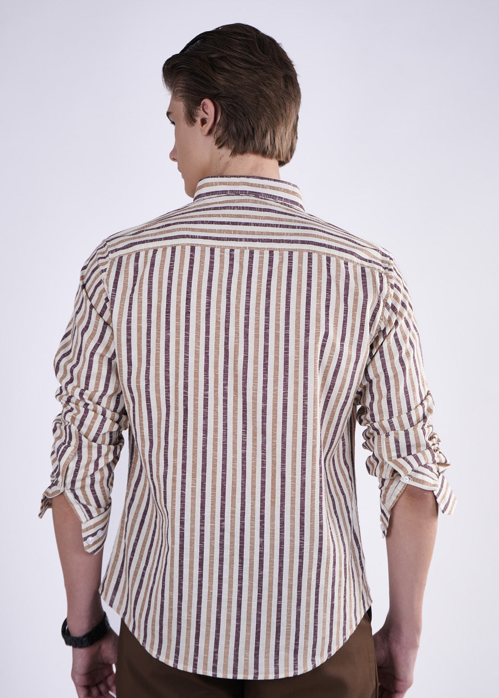Man wearing a striped shirt on a white background