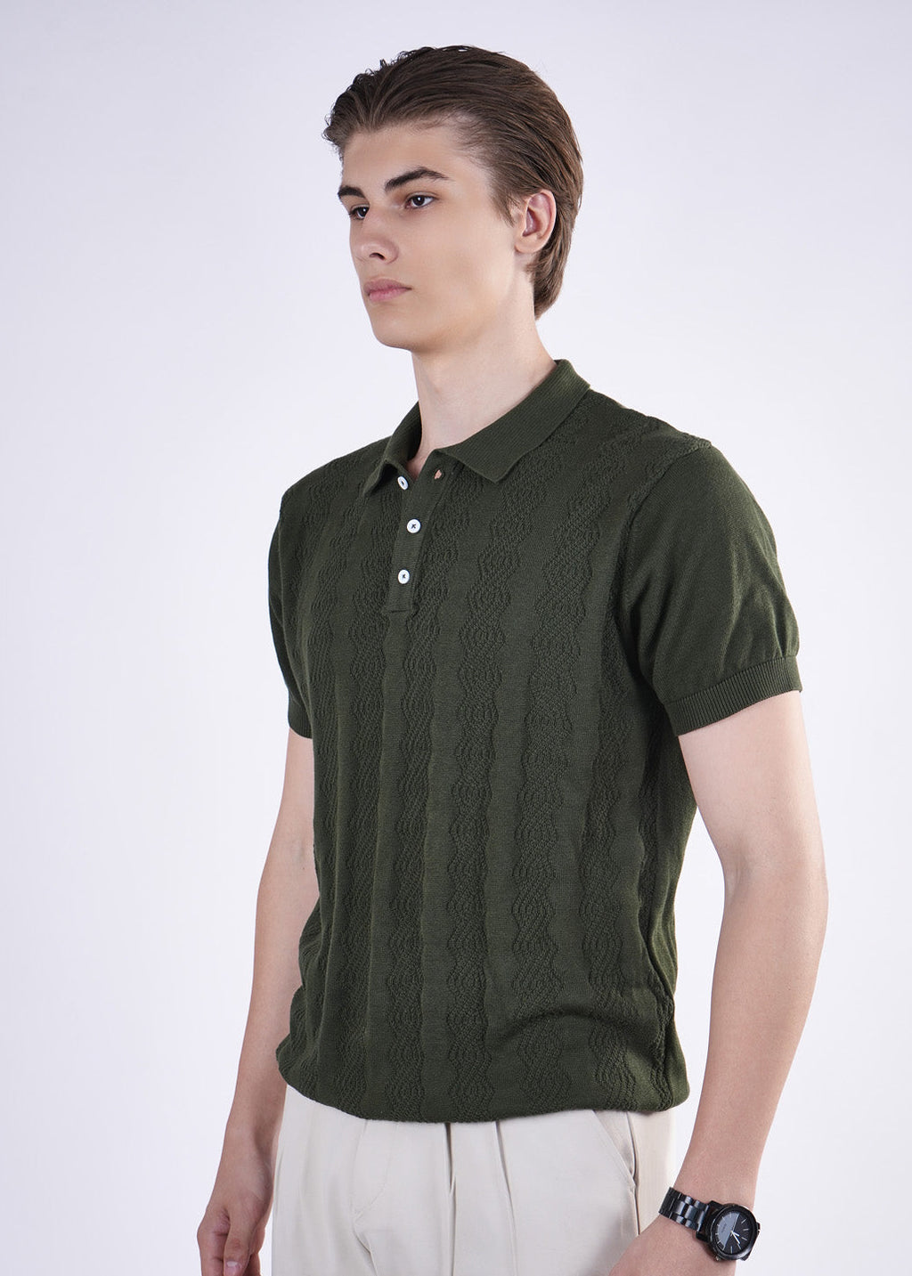 Man wearing a green polo shirt on a white background