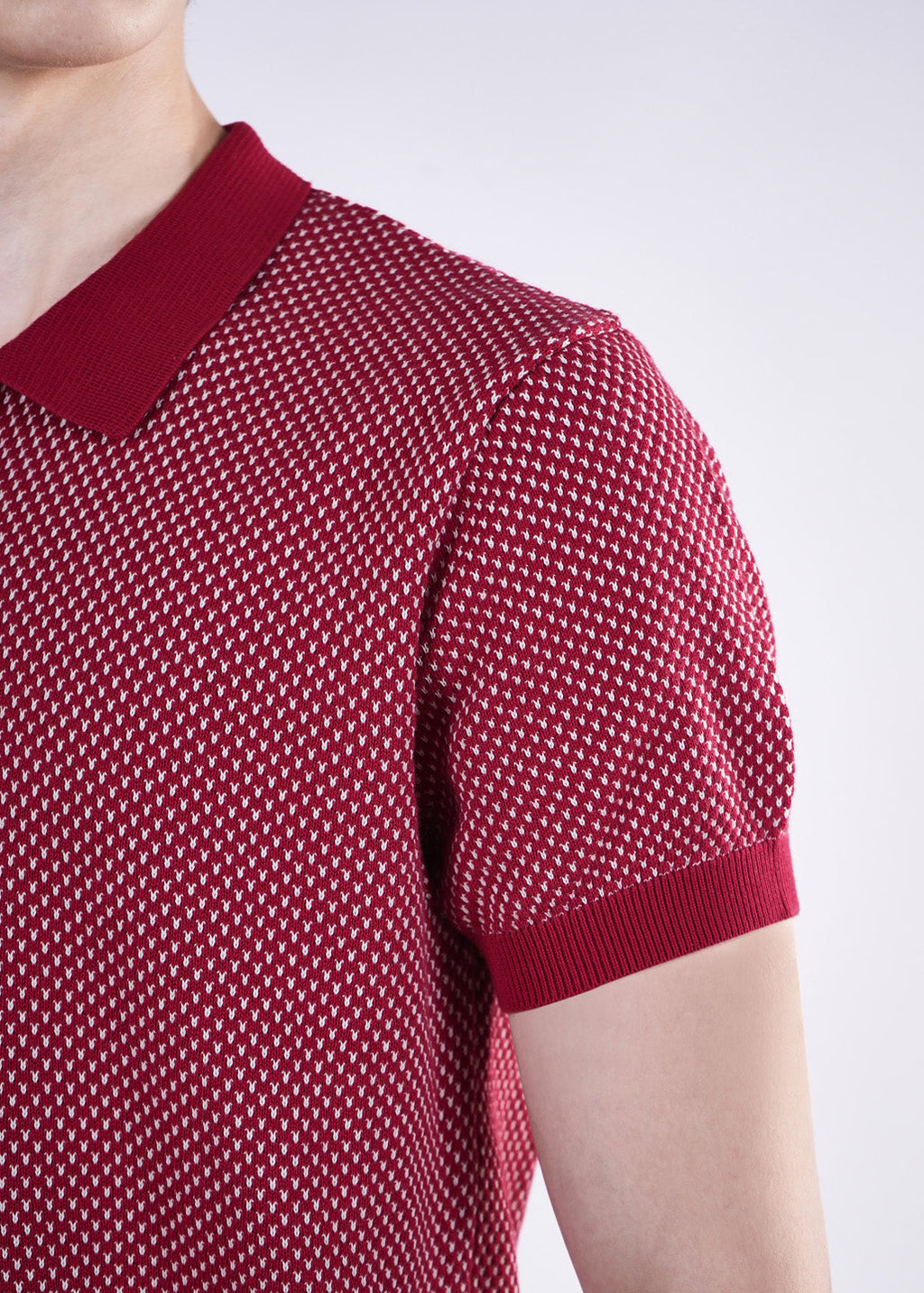 Red patterned short-sleeve shirt on a white background
