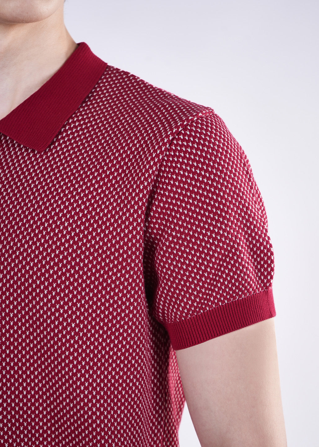 Red patterned short-sleeve shirt on a white background