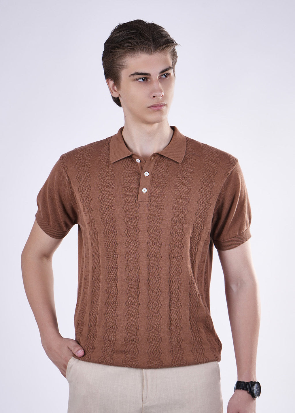 Man wearing a brown textured polo shirt on a white background