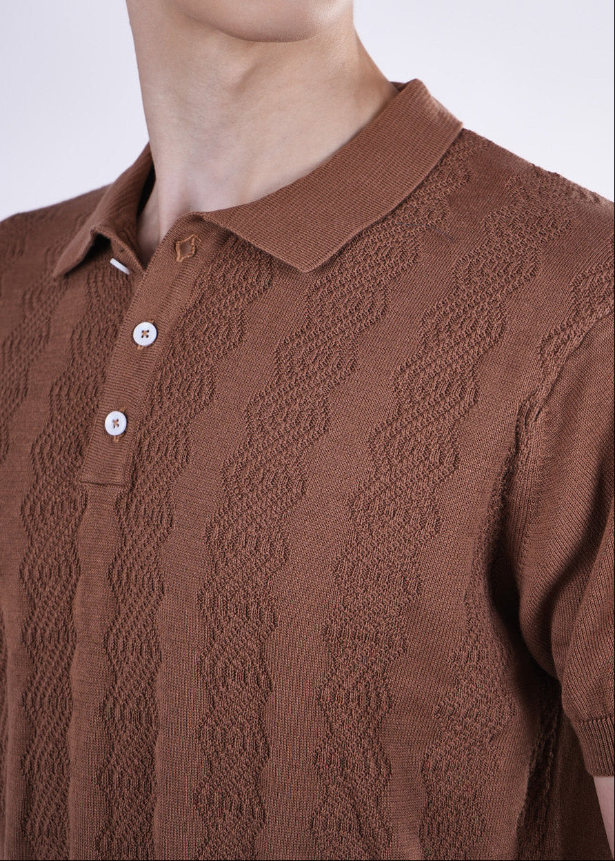 Brown patterned polo shirt worn by a person on a white background