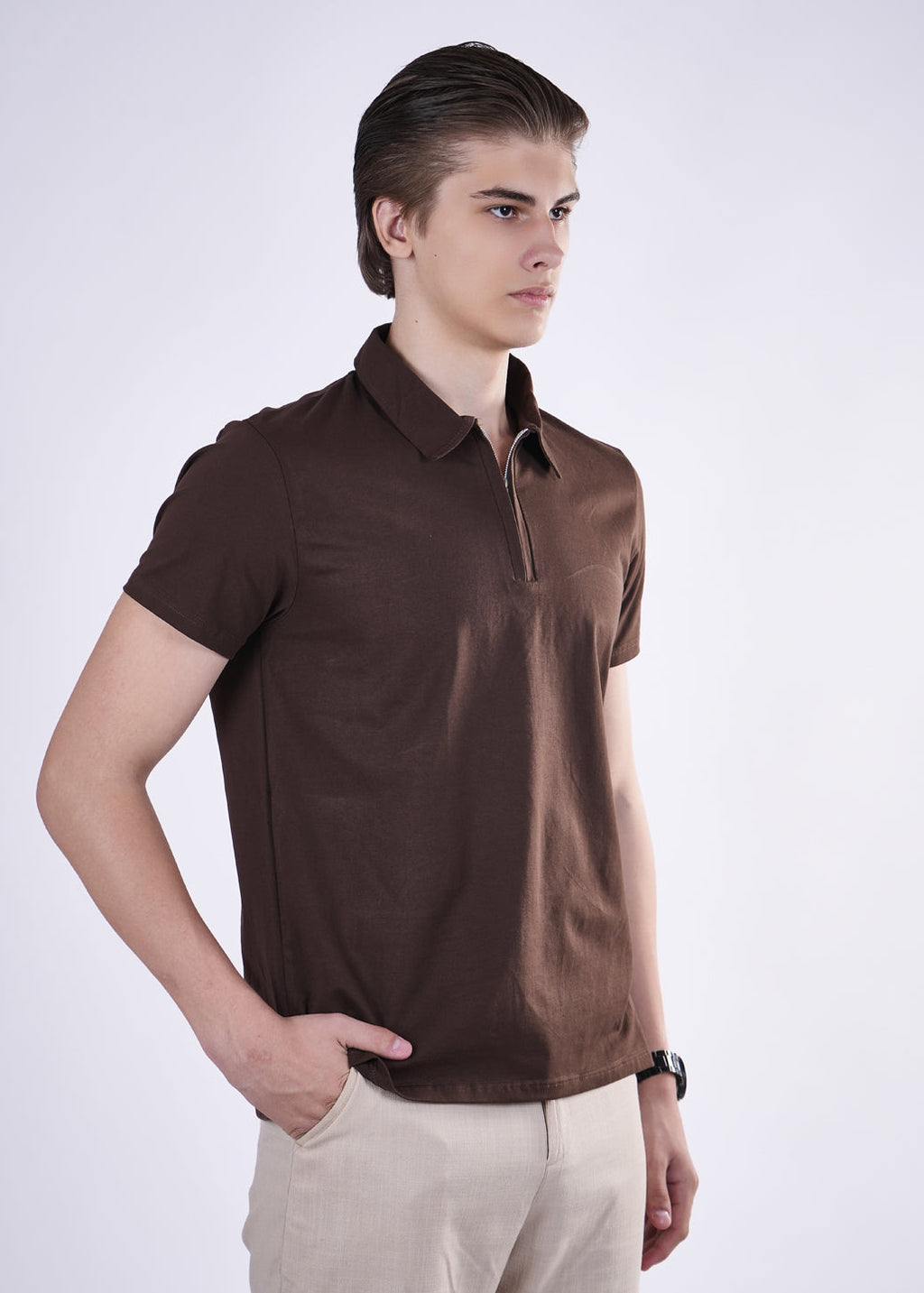Man wearing a brown polo shirt on a white background
