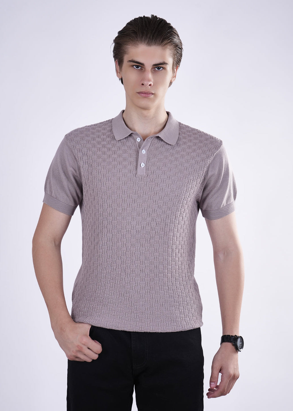 Man wearing a patterned polo shirt against a white background