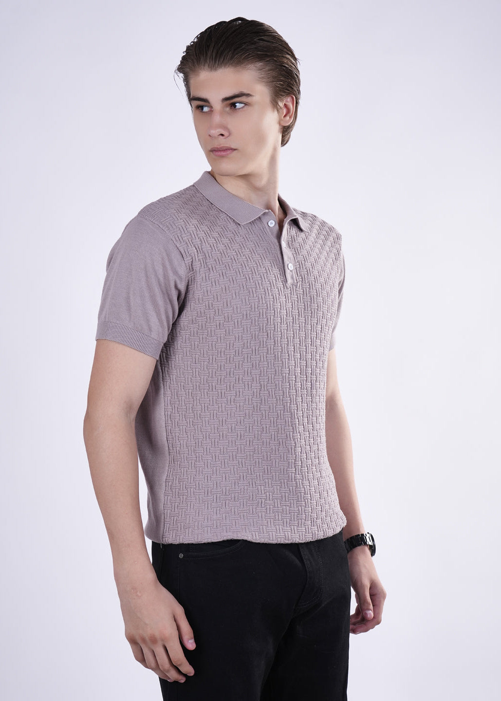 Man wearing a sleeveless patterned shirt on a white background
