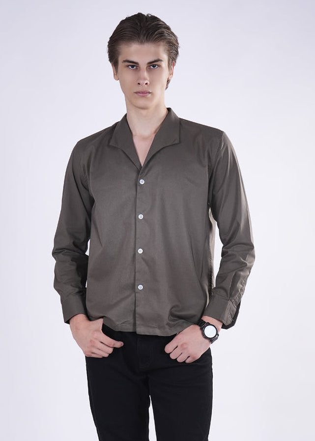 Man wearing a brown button-up shirt on a white background