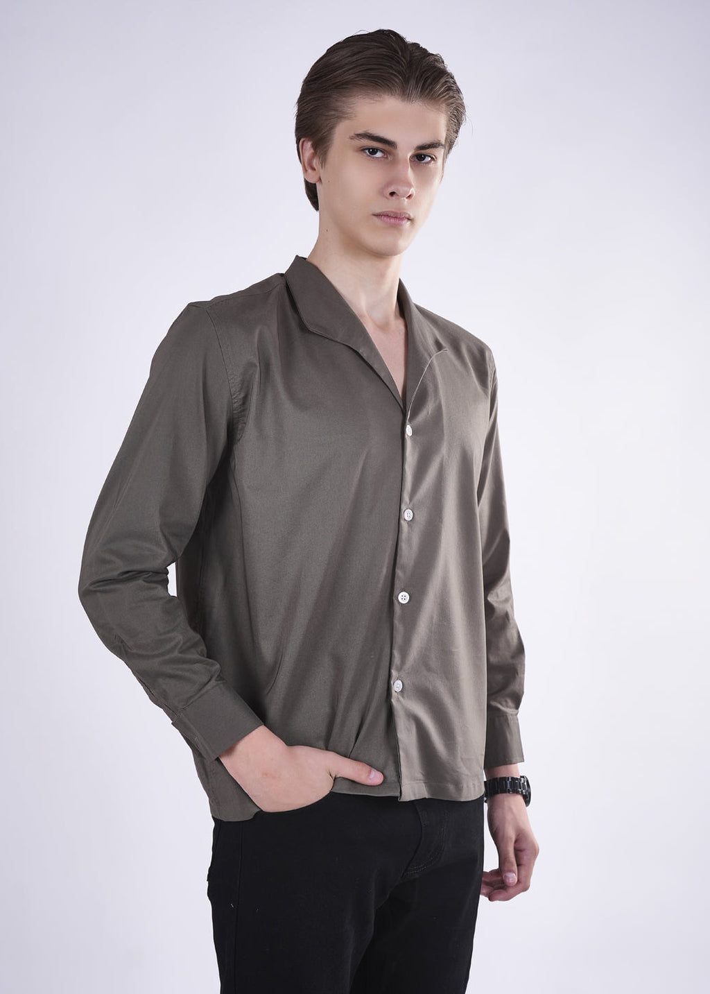 Man wearing a brown shirt with a white background