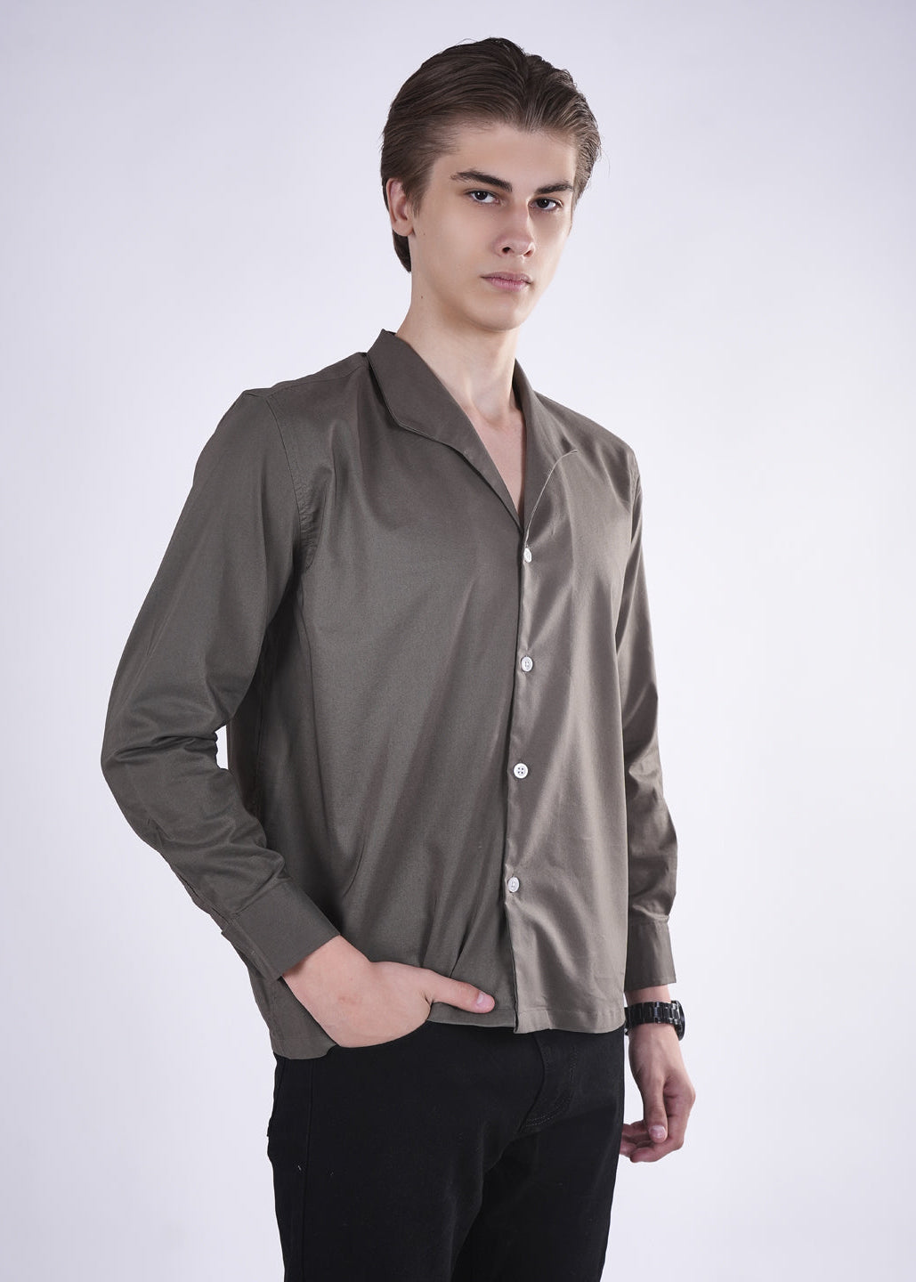 Man wearing a brown shirt with a white background