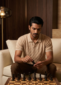 Man playing chess in a stylish living room