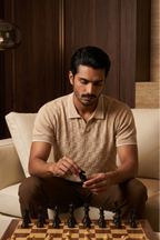 Man playing chess in a stylish living room